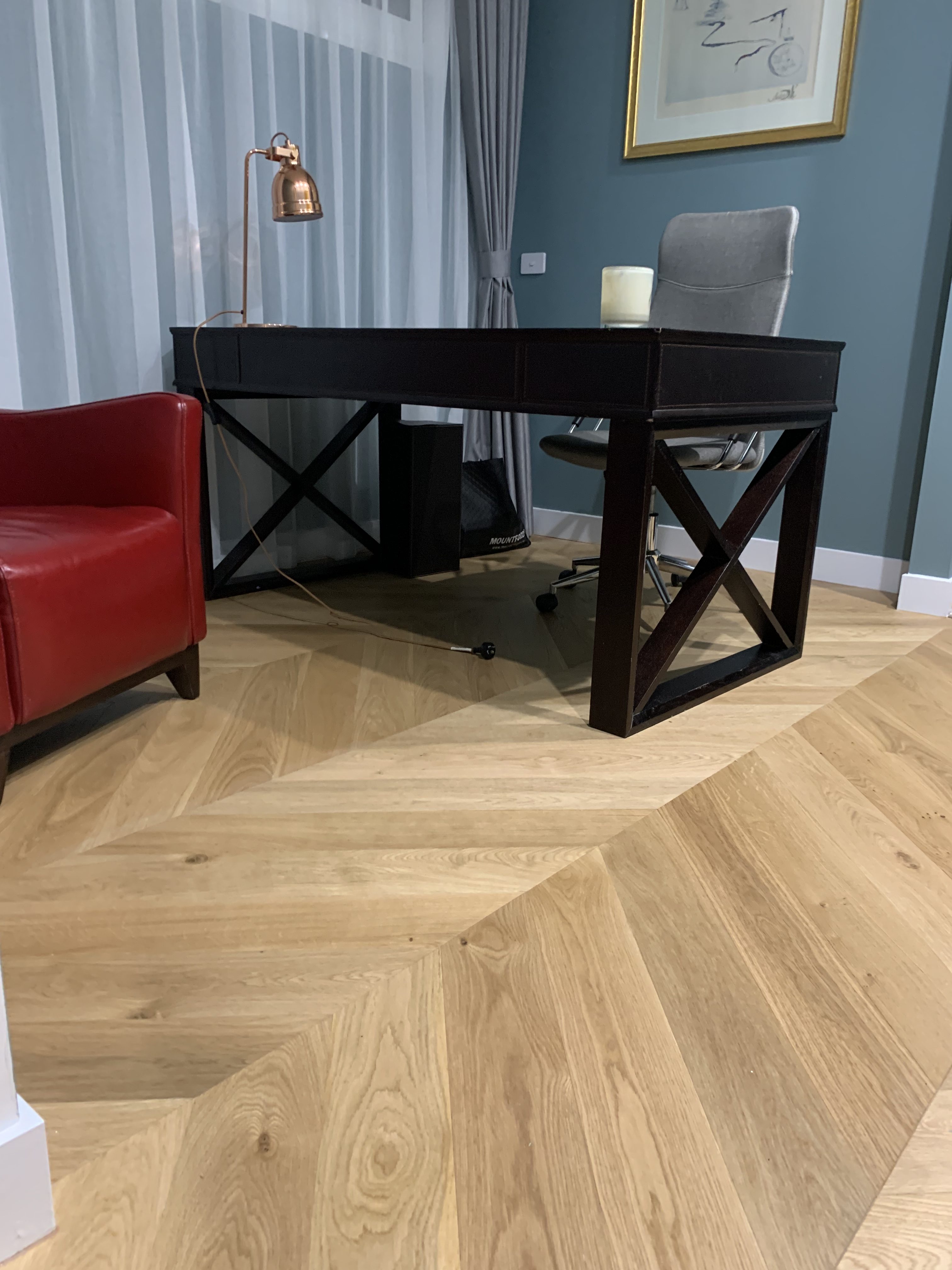 Light oak chevron parquetry flooring in a furnished St Kilda home office