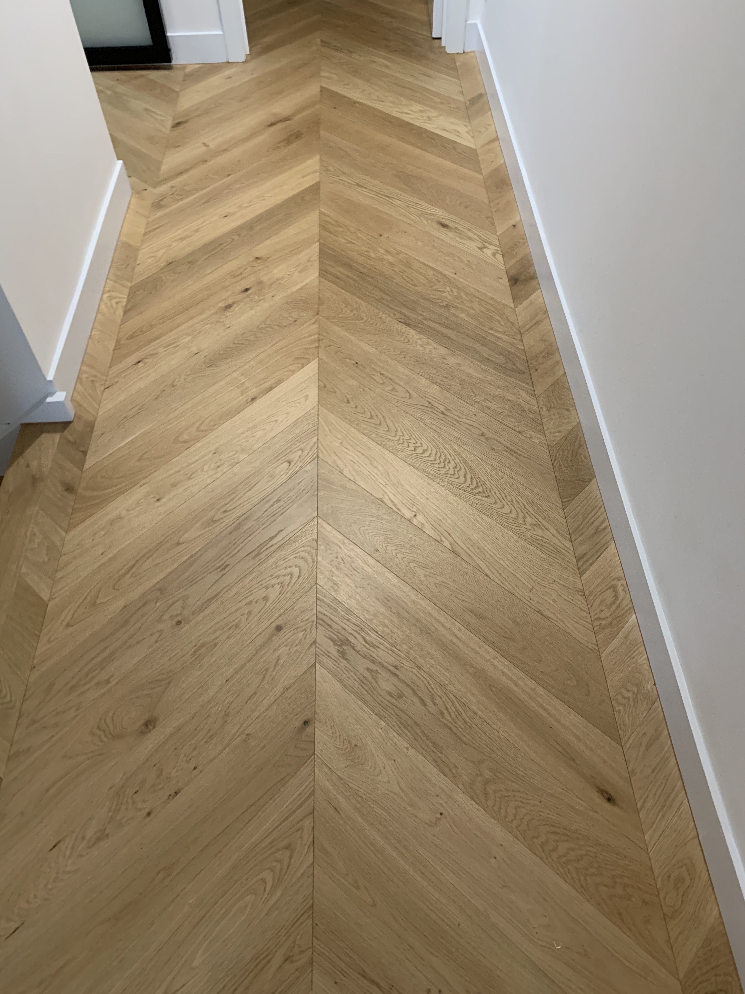 AB Grade European Oak chevron parquetry flooring in a St Kilda townhouse hallway