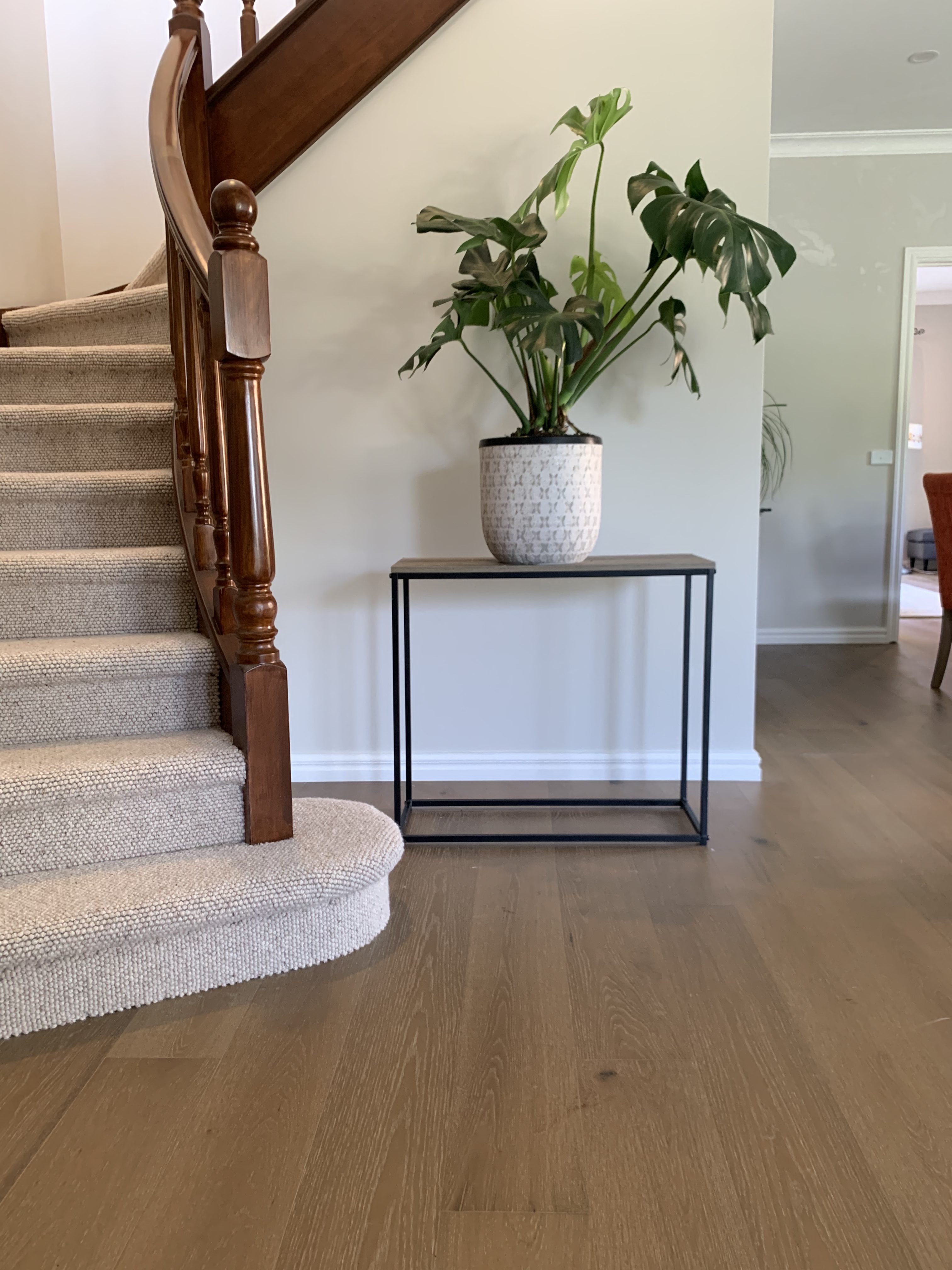 Engineered oak flooring meeting a carpeted staircase in a Glen Waverley entry hall