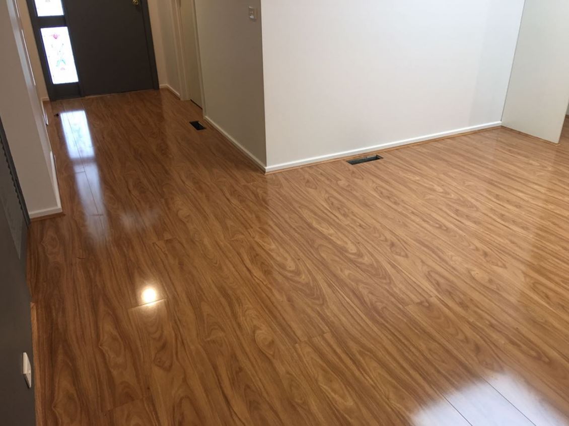 Laminate Blackbutt boards running from the entry hallway into a Rowville living room