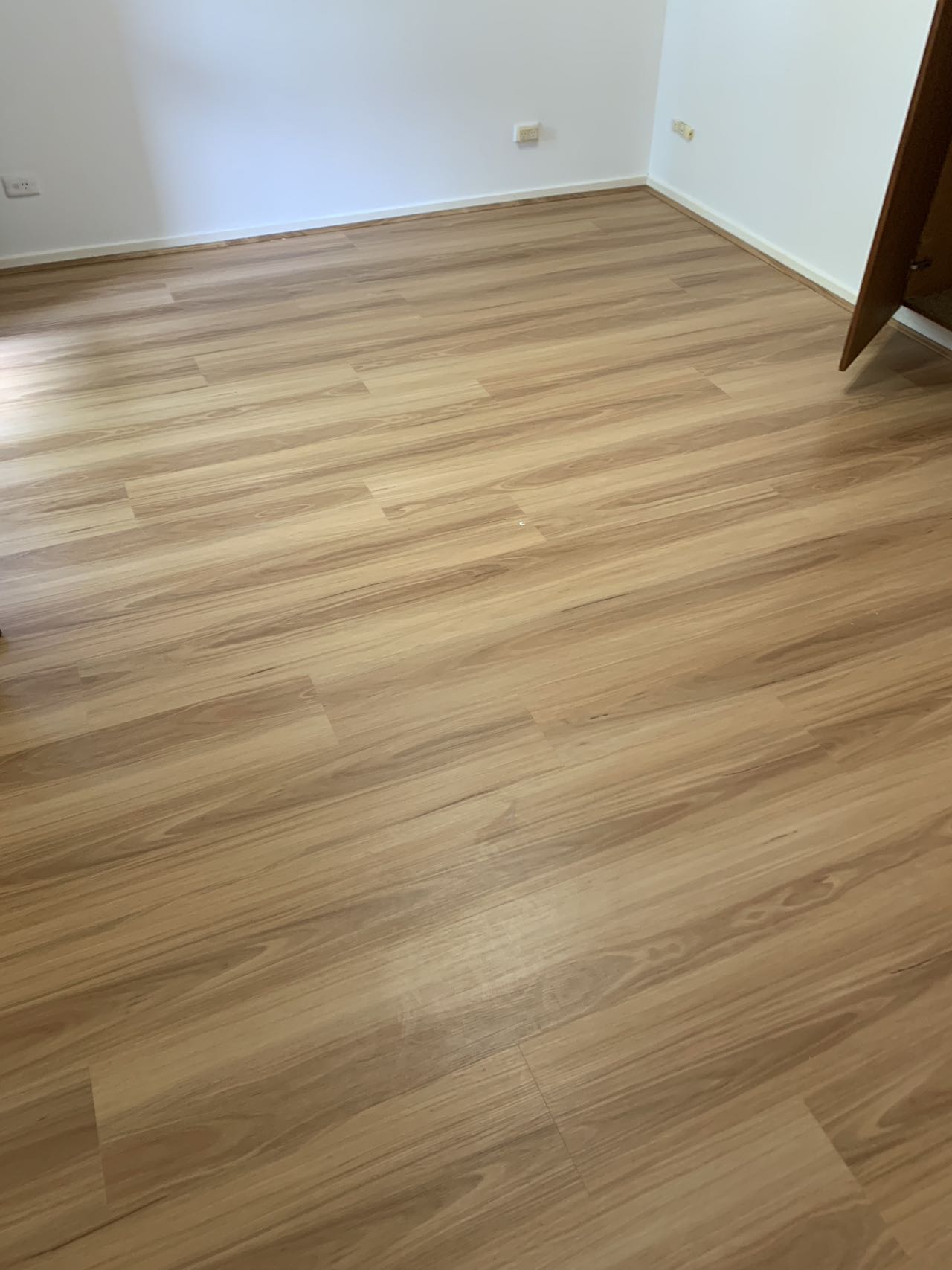 SPC Hybrid Blackbutt flooring in an empty rental property bedroom