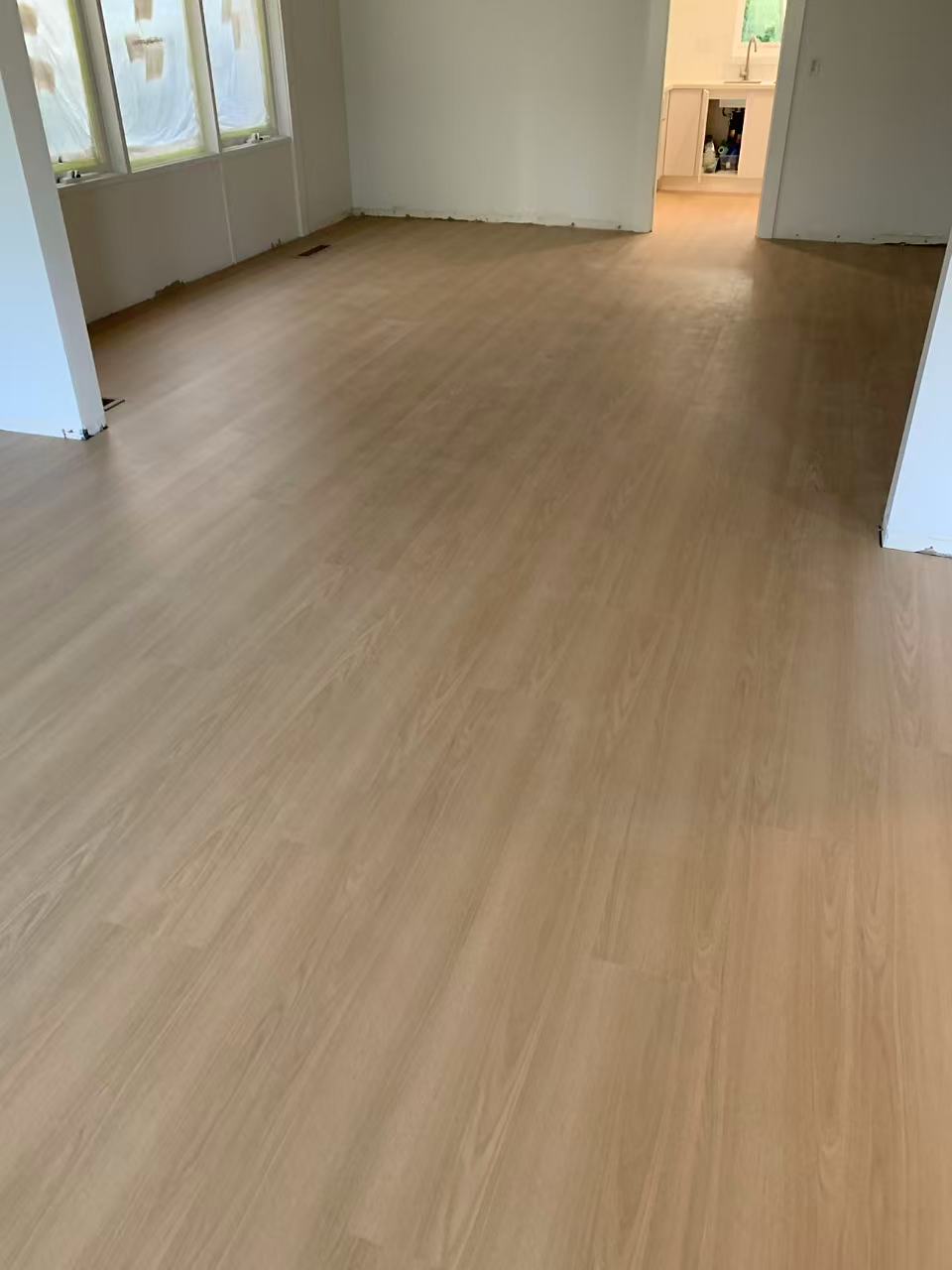 Oak Washed SPC hybrid flooring across a bright open living area in a Caulfield North home